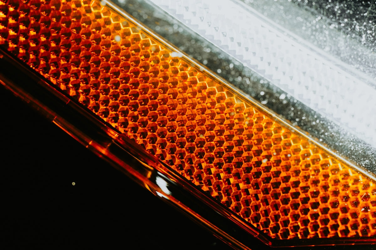 A close up of a street light with snow on it