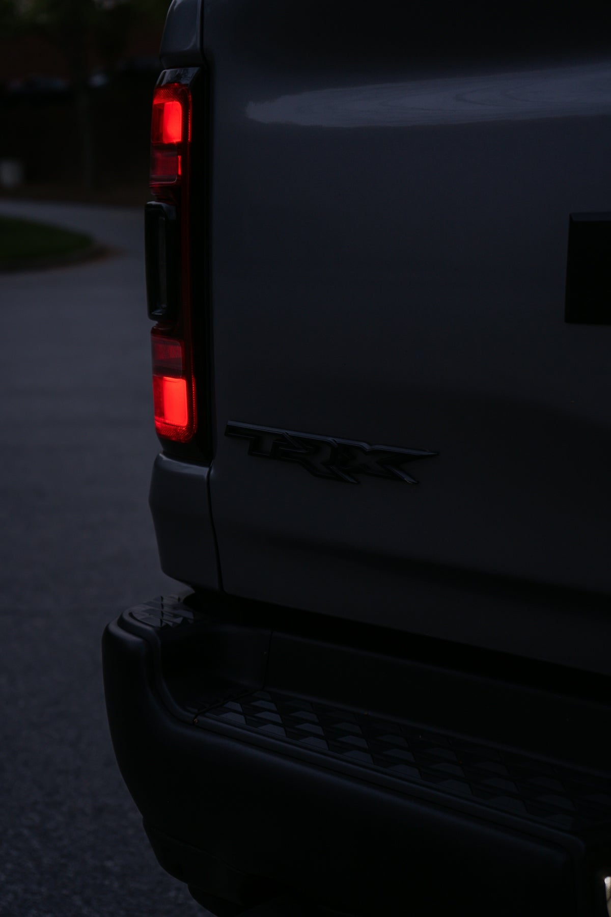 Close-up of a truck's taillight and tailgate.