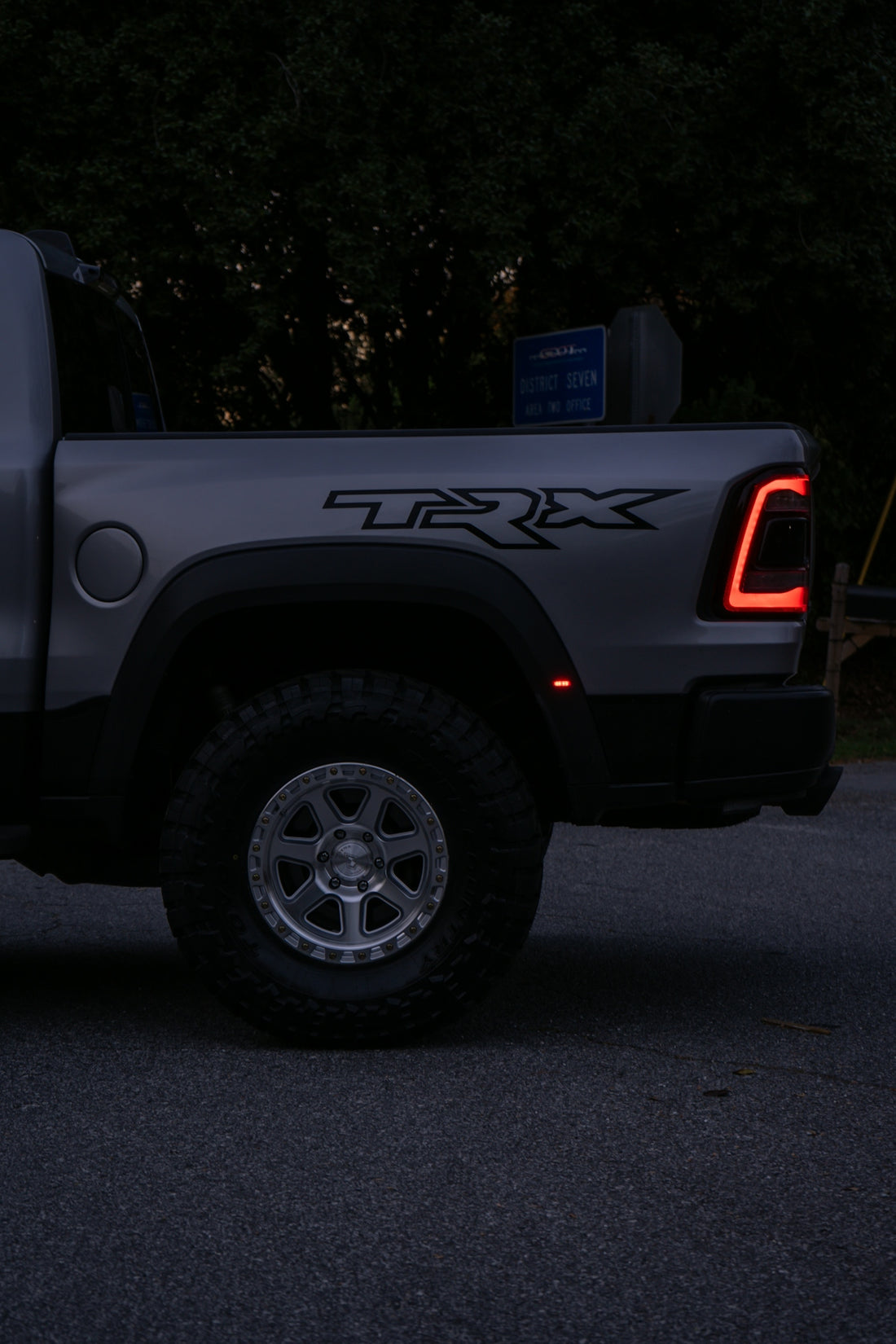 Silver pickup truck with trx badging at dusk